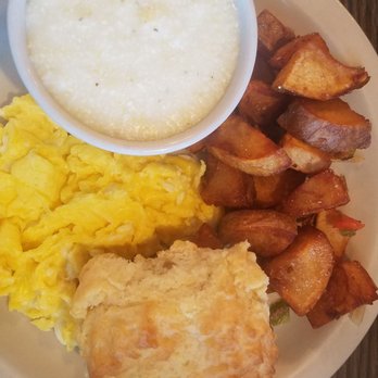Dolly's Farmhouse Restaurant - 2 egg breakfast plate with grits, home fries and a biscuit - Southern Near Me - Austell, Georgia