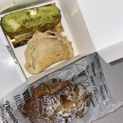 Le Marquis - Pistachio pastry, empanada, and almond croissant