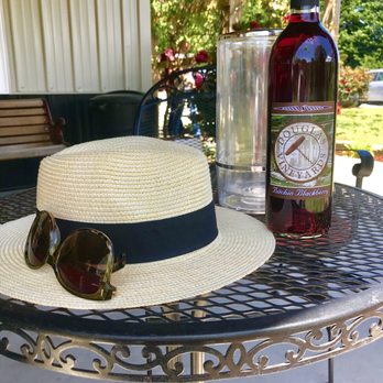 Douglas Vineyards - Outside table and a bottle of Bitchin Blackberry - Wine Tasting Room Near Me - Kannapolis, North Carolina