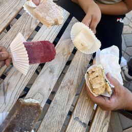 Clockwise from the top: vanilla chai, lavender lemonade, sea salt caramel ice cream sandwich, root beer popsicle, and raspberry plum basil.