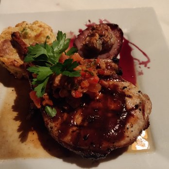 Painted Pony - juniper brined, bone-in pork chop with blue cheese walnut stuffed pear, sweet corn bread pudding, and smoked tomato relish - New American Near Me - Saint George, Utah Painted Pony - juniper brined, bone-in pork chop with blue cheese walnut stuffed pear, sweet corn bread pudding, and smoked tomato relish - New American Near Me - Saint George, Utah