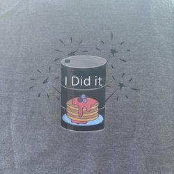 Bucket List Cafe - The front of the shirt you can get if you eat the 55 gallon lid pancake