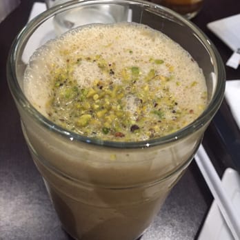 Nespresso Boutique - Tasteless pistachio milkshake  but tasty caramel latte in the background - Coffee & Tea Near Me - Miami, Florida