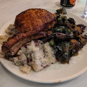 The Refinery - Pork chop with roasted brussels sprouts, and mashed potatoes! Those brussels sprouts were amazing. The pork chop was tender and juicy. - American Near Me - Birmingham, Alabama The Refinery - Pork chop with roasted brussels sprouts, and mashed potatoes! Those brussels sprouts were amazing. The pork chop was tender and juicy. - American Near Me - Birmingham, Alabama