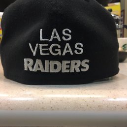 The lettering is the wrong size, color, and crooked.