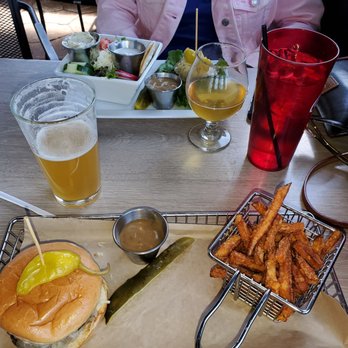Hops Burger Bar - the French onion burger, mine with bun. Sweet potato fries, Pernicious and lemon cello beers - Burgers Near Me - Greensboro, North Carolina Hops Burger Bar - the French onion burger, mine with bun. Sweet potato fries, Pernicious and lemon cello beers - Burgers Near Me - Greensboro, North Carolina