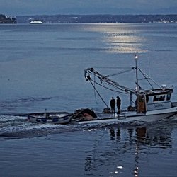 The Maritime Inn - A fishing boat headed out at twilight