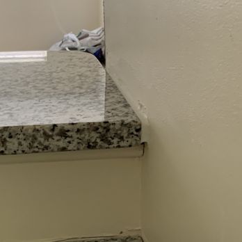 Art Stone Granite and Marble - Chalking along side of bar for granite that doesn't fit. - Building Supplies Near Me - Marietta, Georgia