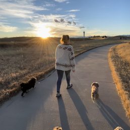 Walking on a path through the park. Dogs should be leashed and cleaned up after.