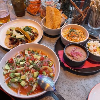 LMNO - Adobado tacos, crispy tortillas and saltine crackers, esquites, rice, refried beans, and the rojo aguachiles. - Mexican Near Me - Philadelphia, Pennsylvania LMNO - Adobado tacos, crispy tortillas and saltine crackers, esquites, rice, refried beans, and the rojo aguachiles. - Mexican Near Me - Philadelphia, Pennsylvania