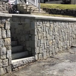 Andover Stone - Granite stone wall with poured in place concrete cap