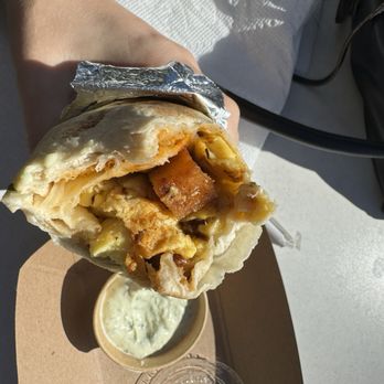 Papi’s Burritos - Inside of vegetarian burrito with dipping sauce that comes with it - Breakfast & Brunch Near Me - Orlando, Florida
