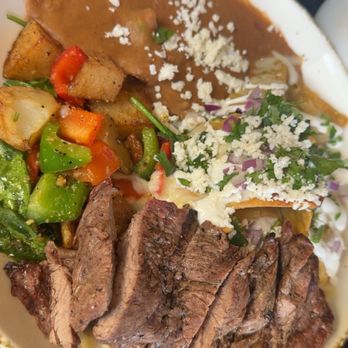 Clandestino Gastro-Bar - Green chilaquiles w ribeye - Latin American Near Me - Azusa, California Clandestino Gastro-Bar - Green chilaquiles w ribeye - Latin American Near Me - Azusa, California