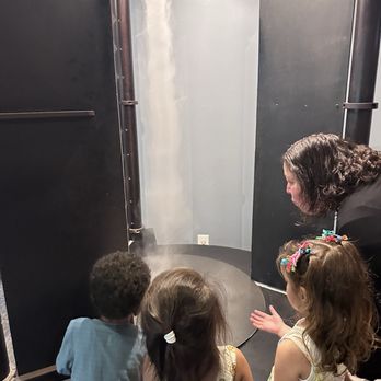 Discovery Cube Orange County - Looking at a steam machine - Children's Museums Near Me - Santa Ana, California