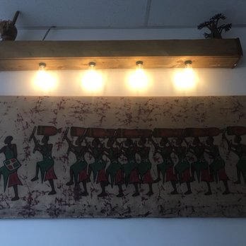 Diolo - a picture of a painting on a wall - Senegalese Near Me - Montreal, Quebec