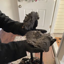 The beginning of the vent cleaning . Just getting started it was thick compacted lint
