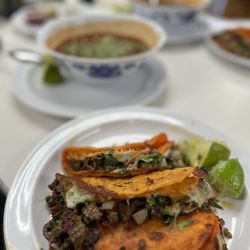 Tienda Latina y Taqueria - Cheese tacos with asada, bowl of birria