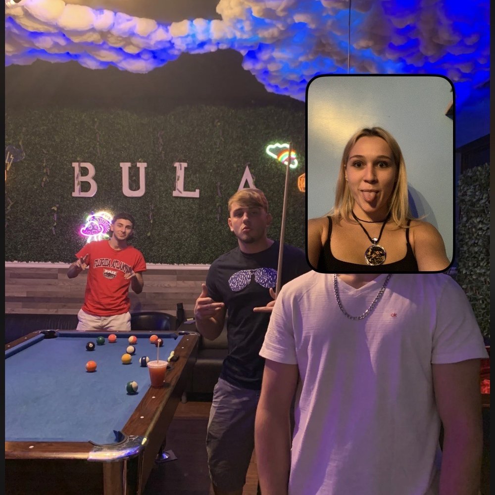 Herb’n Roots - a man and a woman playing pool - Tea Rooms Near Me - Boca Raton, Florida