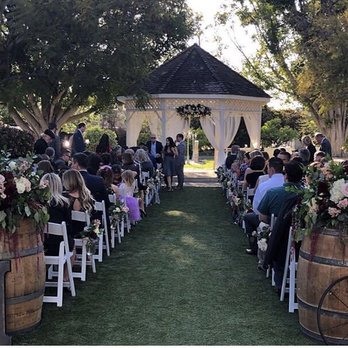Gold Finch Florals - Huge barrel flower arrangements, aisle flowers, Swag, and tulle artistically arranged and perfect - Floral Designers Near Me - Laguna Beach, California