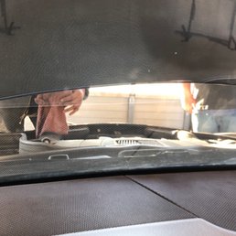 Two of them working on the car Two of them working on the car
