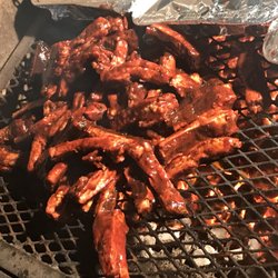 Wildwood BBQ - Ribs are on the grill all sauced up