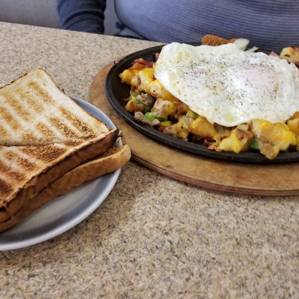 Meat lovers skillet with toast.