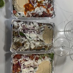 Shah's Halal Food-Alexandria - Combo platter w/ hot sauce, kabob platter and chicken platter. All with hummus, onions & peppers and white sauce