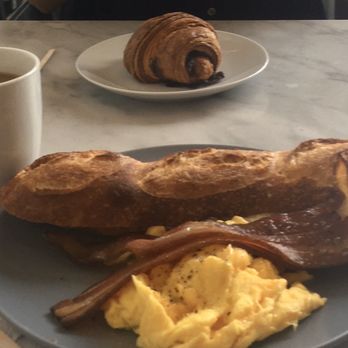 Dozen Bakery - Split baguette with eggs and bacon, ham and cheese croissant. - Bakeries Near Me - Nashville, Tennessee Dozen Bakery - Split baguette with eggs and bacon, ham and cheese croissant. - Bakeries Near Me - Nashville, Tennessee