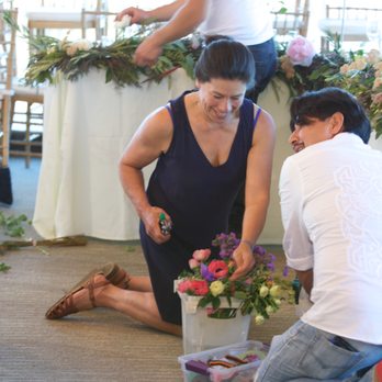Decolores Flores - Tammy and team working calmly under pressure getting transforming the ceremony area into the dinner reception - Florists Near Me