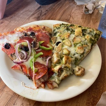 NiMarco's Pizza - Downtown - One slice of their specialty pizza and one slice of chicken pesto - Pizza Near Me - Flagstaff, Arizona NiMarco's Pizza - Downtown - One slice of their specialty pizza and one slice of chicken pesto - Pizza Near Me - Flagstaff, Arizona