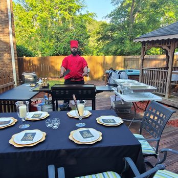 Royal Delights - a man preparing a meal on a patio - Teppanyaki Near Me Royal Delights - a man preparing a meal on a patio - Teppanyaki Near Me
