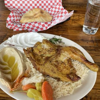 Sizzle - Half Grilled Chicken with rice, pita, hummus, and garlic dip - Mediterranean Near Me - Denver, Colorado Sizzle - Half Grilled Chicken with rice, pita, hummus, and garlic dip - Mediterranean Near Me - Denver, Colorado