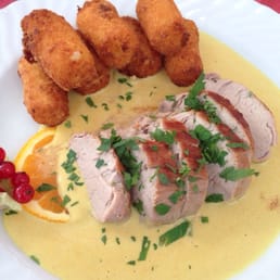 Roast pork in mustard sauce, with potato croquettes. Roast pork in mustard sauce, with potato croquettes.