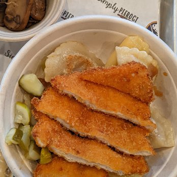 Simply Pierogi - Pierogi Bowl with caramelizing onion, pickles, sautéed mushrooms, mushrooms sauce and schnitzel. - Polish Near Me - Buffalo, New York Simply Pierogi - Pierogi Bowl with caramelizing onion, pickles, sautéed mushrooms, mushrooms sauce and schnitzel. - Polish Near Me - Buffalo, New York