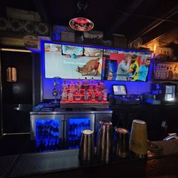 Behind the bar.