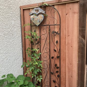 Maranatha Fences - AFTER: Very detail oriented - they replaced my metal trellis, climbing vines, & wood heart decoration beautifully. - Fences & Gates Near Me Maranatha Fences - AFTER: Very detail oriented - they replaced my metal trellis, climbing vines, & wood heart decoration beautifully. - Fences & Gates Near Me