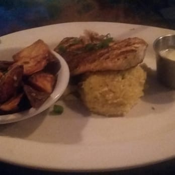 Bon Temps Grill - Blackened Mahi Mahi with herb cream sauce, jalapeño grits, and country fryers. I am full! - Cajun/Creole Near Me - Lafayette, Louisiana Bon Temps Grill - Blackened Mahi Mahi with herb cream sauce, jalapeño grits, and country fryers. I am full! - Cajun/Creole Near Me - Lafayette, Louisiana