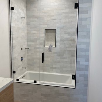 J's Custom Glass - Frameless ultra clear glass shower/tub combo door with matte black hardware - Windows Installation Near Me J's Custom Glass - Frameless ultra clear glass shower/tub combo door with matte black hardware - Windows Installation Near Me