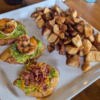 Crystal Lake Junction - Avocado on crostini, one with bacon and cheese, two with grilled shrimp. Roasted potatoes. - American Near Me - Crystal Lake, Illinois