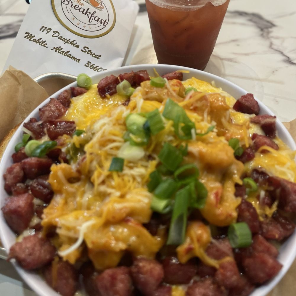 The Breakfast Spot - Conecuh Bowl topped with Homemade Creole Sauce and a Bloody Mary. Will make your soul sing!! - Breakfast & Brunch Near Me - Mobile, Alabama The Breakfast Spot - Conecuh Bowl topped with Homemade Creole Sauce and a Bloody Mary. Will make your soul sing!! - Breakfast & Brunch Near Me - Mobile, Alabama