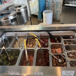 Sunfish Poke Bar - 1/2 of the toppings offered including the raw and cooked meat options.