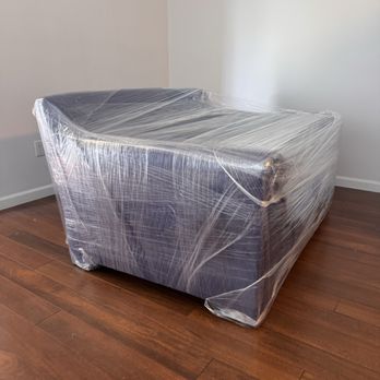 Florida Coast Moving - Fully Blanket Wrapped Couch. - Movers Near Me Florida Coast Moving - Fully Blanket Wrapped Couch. - Movers Near Me