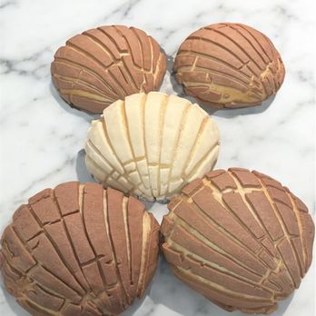 Mrs Conchy - Classic Conchas:
Vanilla or Chocolate
Our classic conchas bring you that perfect balance of airy, soft bread & a sweet crunchy topping - Bakeries Near Me Mrs Conchy - Classic Conchas:
Vanilla or Chocolate
Our classic conchas bring you that perfect balance of airy, soft bread & a sweet crunchy topping - Bakeries Near Me