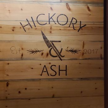 Hickory & Ash - Restaurant signage in the front of house behind hostess stand - Steakhouses Near Me - Broomfield, Colorado