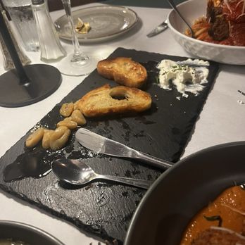Lamplighter Restaurant - Appetizer Cristini with homemade ricotta, cheese and oven roasted garlic - Italian Near Me - Rochester, New York Lamplighter Restaurant - Appetizer Cristini with homemade ricotta, cheese and oven roasted garlic - Italian Near Me - Rochester, New York