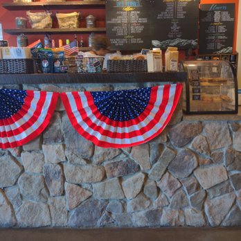Scenic Brew - a stone wall with american flags on it - Coffee & Tea Near Me - Helena, Montana Scenic Brew - a stone wall with american flags on it - Coffee & Tea Near Me - Helena, Montana