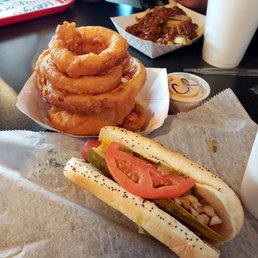 Chicago dog, sans peppers and a side of onion rings. Chicago dog, sans peppers and a side of onion rings.