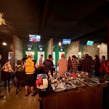 LA Threaux - a group of people at a bar - Axe Throwing Near Me - Gonzales, Louisiana LA Threaux - a group of people at a bar - Axe Throwing Near Me - Gonzales, Louisiana