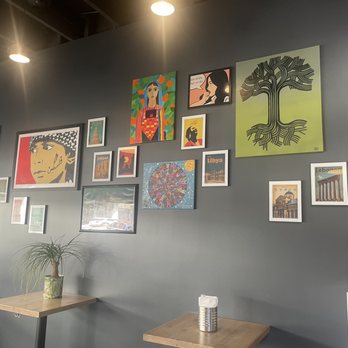 Shawarmaji - Interior / wall showing art from the region. Palestine, Lebanon, Libya, Jordan, Syria, maybe others (forgot now). - Middle Eastern Near Me - Oakland, California