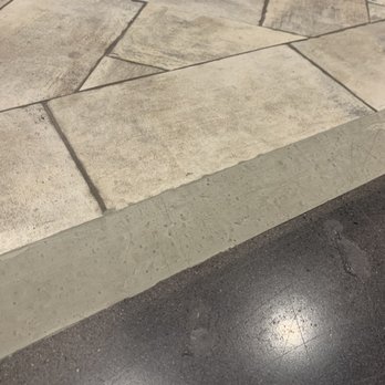 OC Concrete Stain - The concrete ramp blending the tile into the concrete floor. Looks awful still needs to be smoothed and stained. - Masonry/Concrete Near Me OC Concrete Stain - The concrete ramp blending the tile into the concrete floor. Looks awful still needs to be smoothed and stained. - Masonry/Concrete Near Me